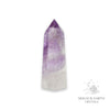 Amethyst crystal tower on a white background with 'Magick Earth Crystals' branding for Sacred Stillness