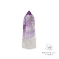 Amethyst crystal tower on a white background with 'Magick Earth Crystals' branding for Sacred Stillness