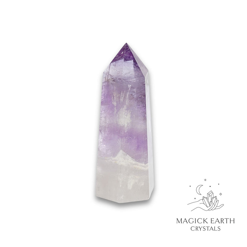 Amethyst crystal tower on a white background with 'Magick Earth Crystals' logo for Sacred Stillness