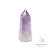 Amethyst crystal tower on a white background with 'Magick Earth Crystals' logo for Sacred Stillness