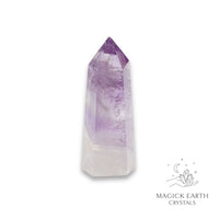 Amethyst crystal tower on a white background with 'Magick Earth Crystals' logo for Sacred Stillness