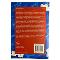 Back  cover of 'Aromatherapy Handbook for Beauty, Hair, and Skin Care' by Erich Keller with floral design on a blue background.