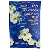 Front  cover of 'Aromatherapy Handbook for Beauty, Hair, and Skin Care' by Erich Keller with floral design on a blue background.