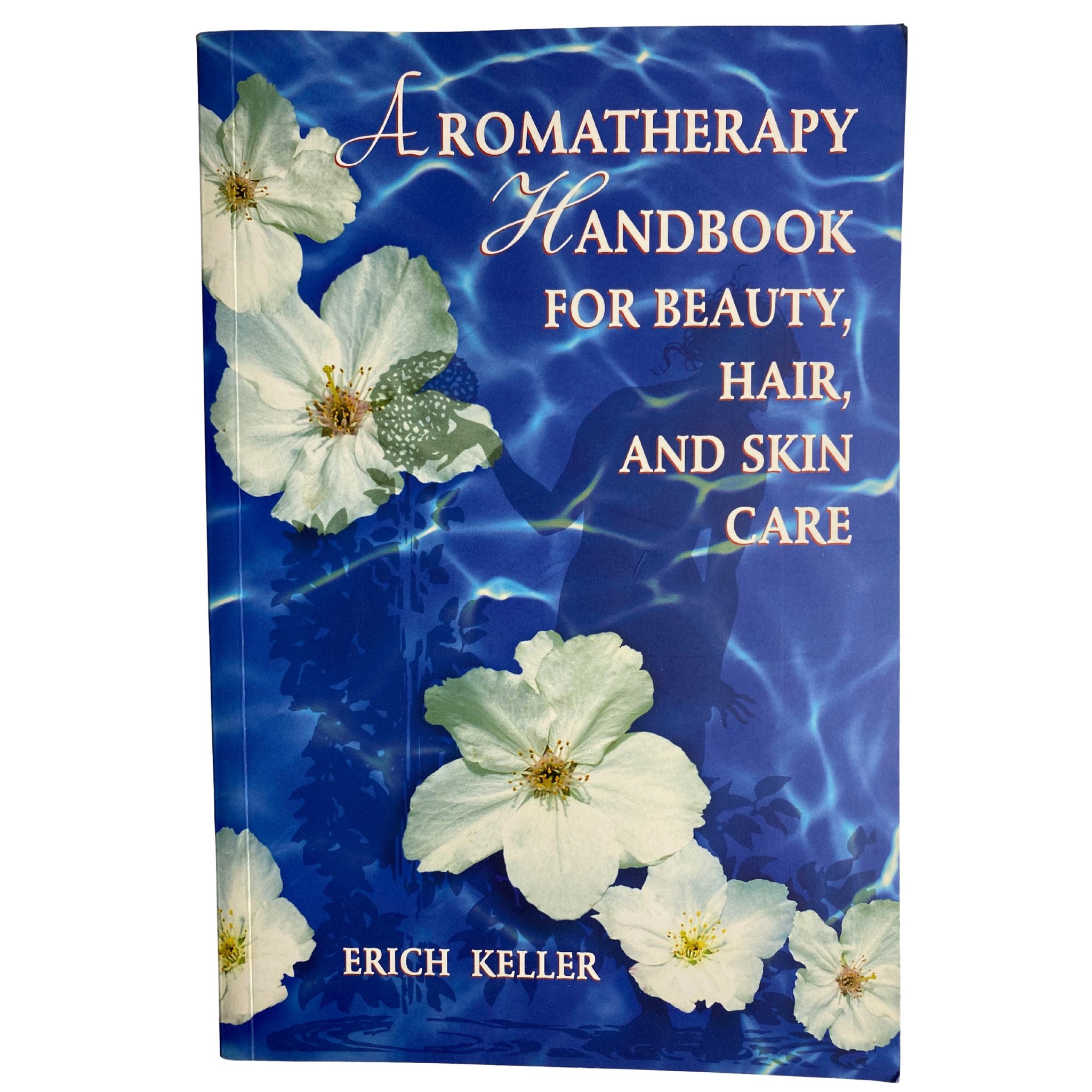 Front  cover of 'Aromatherapy Handbook for Beauty, Hair, and Skin Care' by Erich Keller with floral design on a blue background.