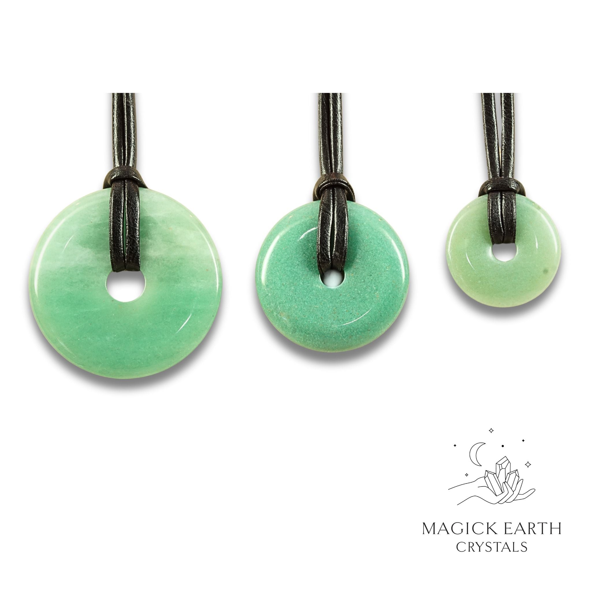 Natural aventurine  donut pendants in three sizes hanging from black vegan cords arranged left to right from large to small