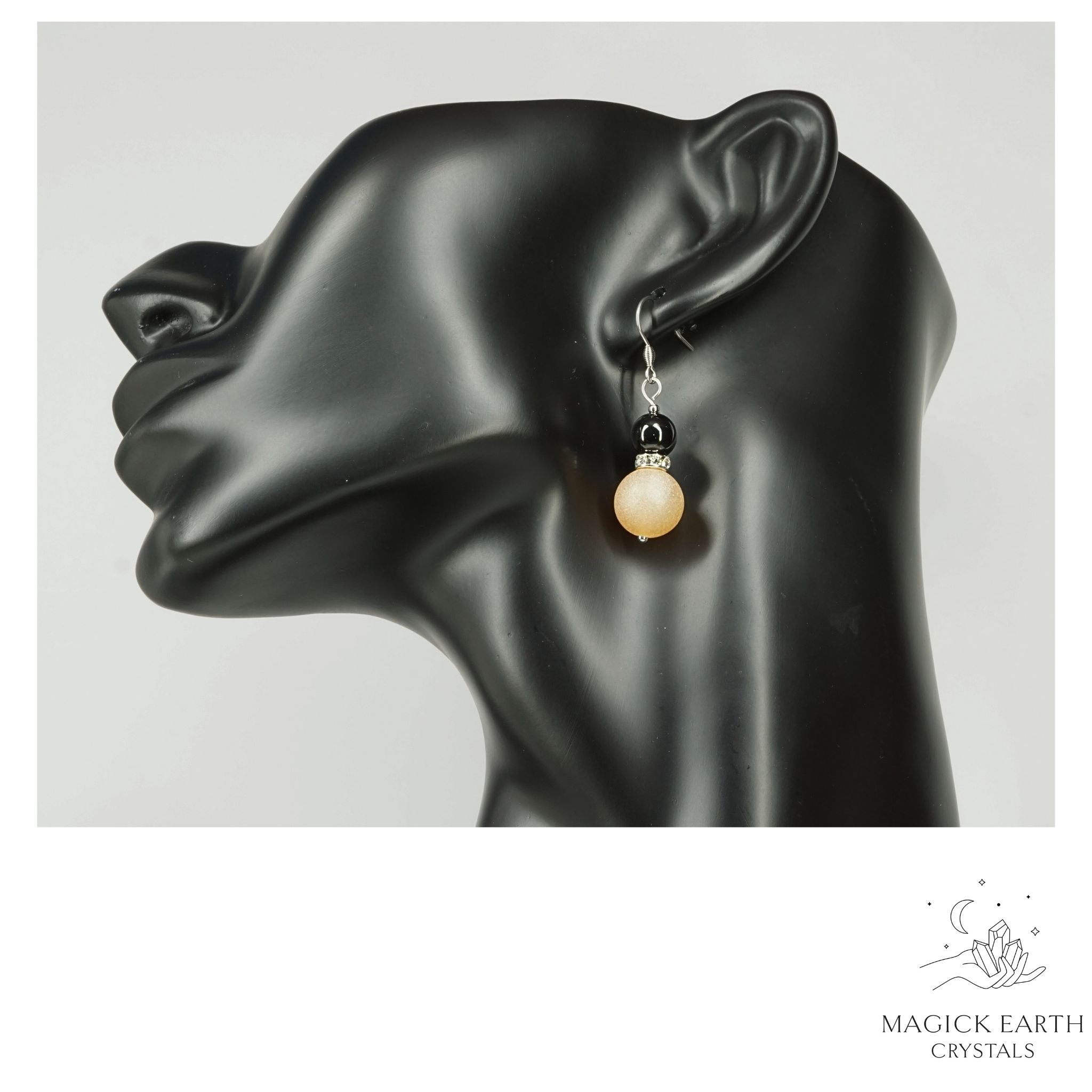 Beige Electroplated Druzy Geode and Obsidian Earrings With Platinum Finish on Display Head