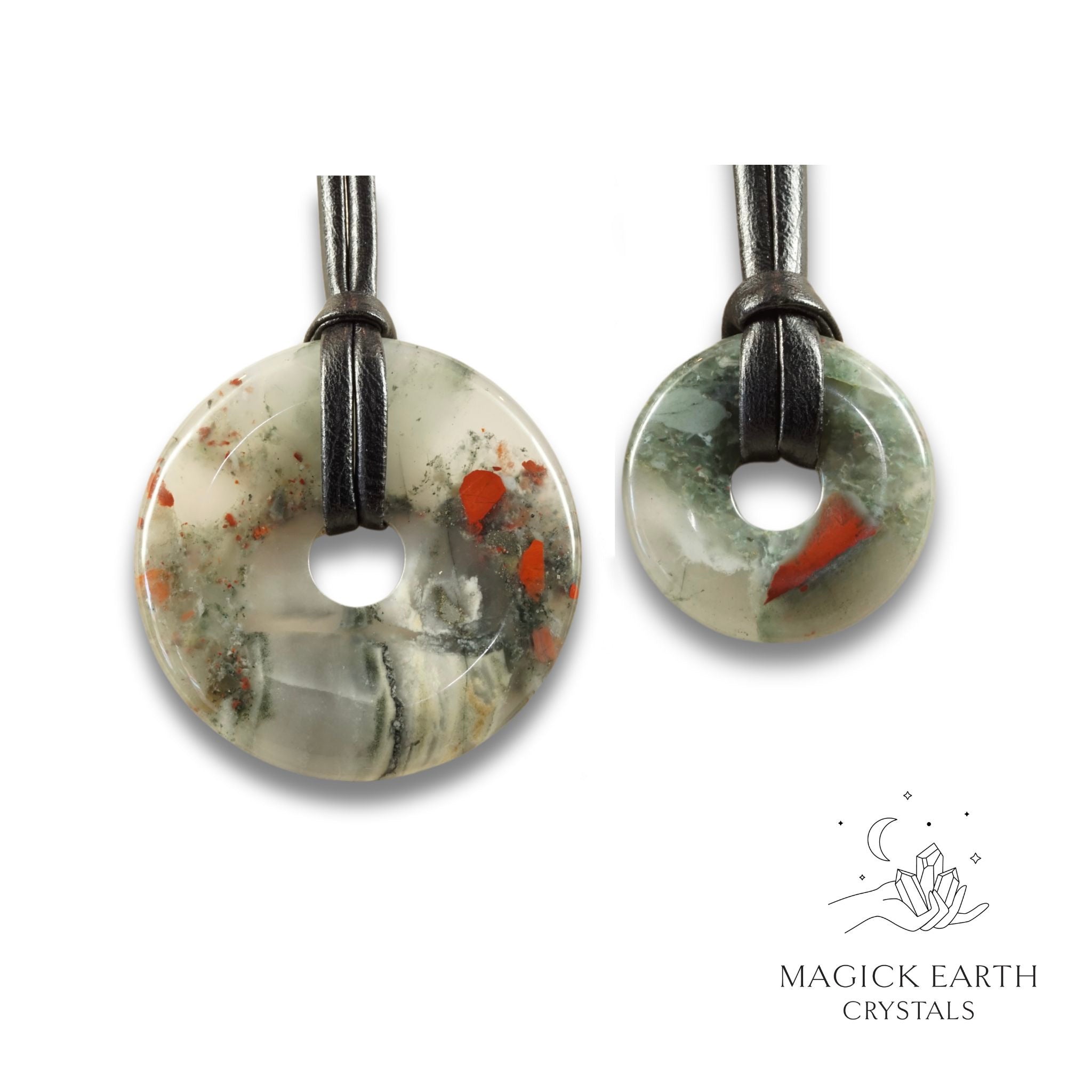 Natural bloodstone donut pendants in two sizes hanging from black vegan cords arranged left to right from large to small