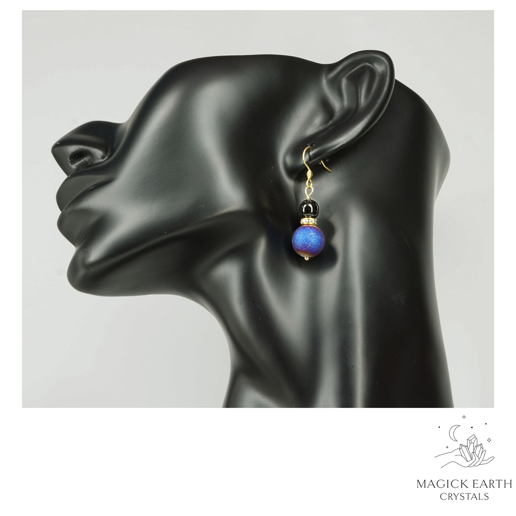 Blue Electroplated Druzy Geode and Obsidian Earrings With Gold Finish on display head