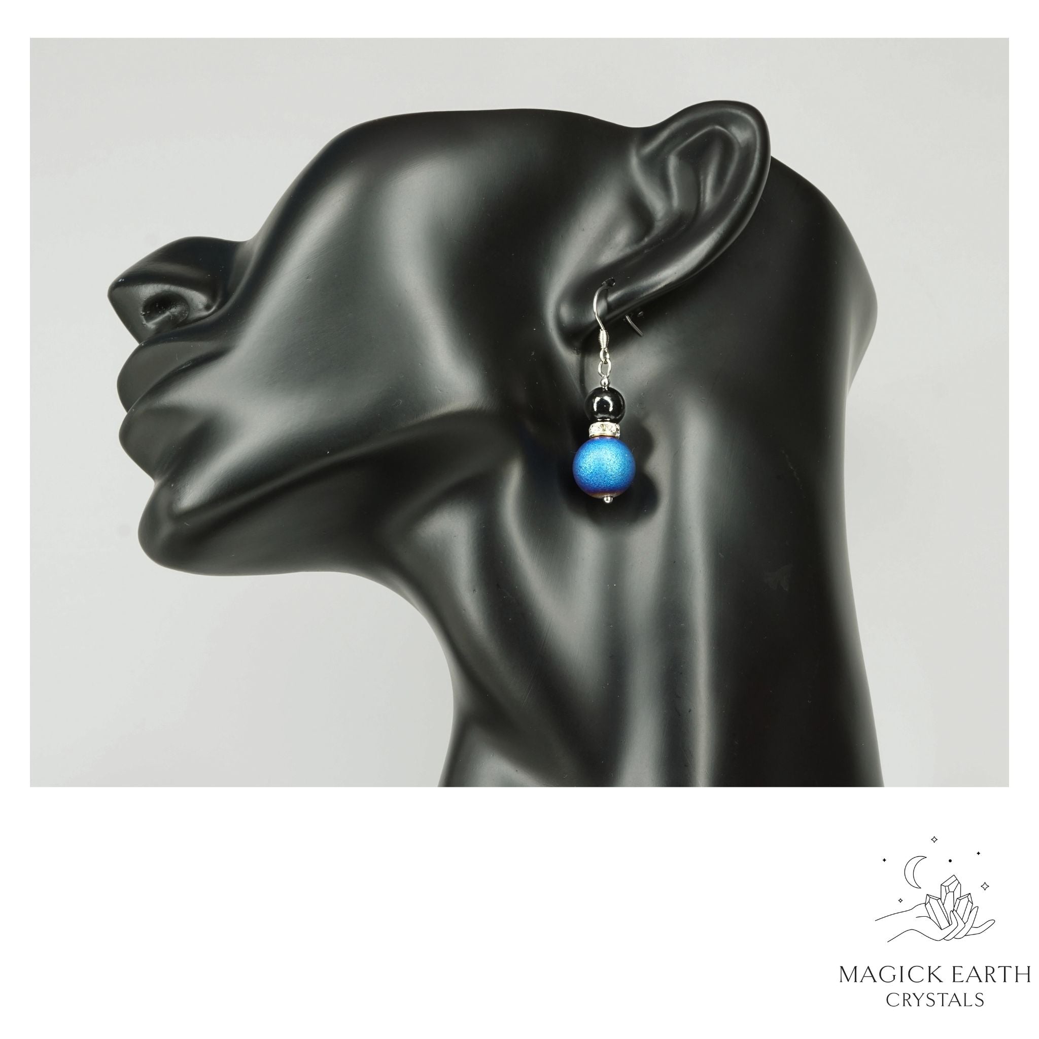 Blue Electroplated Druzy Geode and Obsidian Earrings With Platinum Finish on display head
