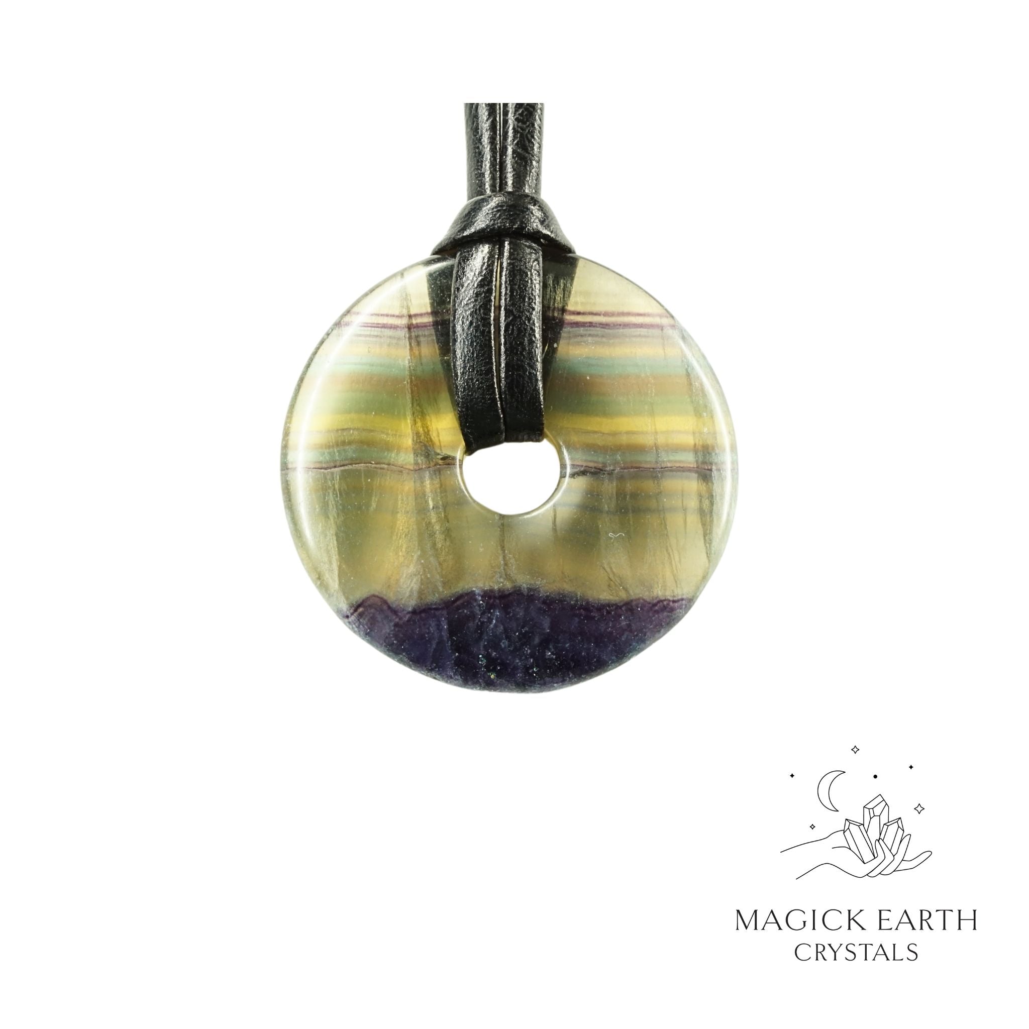Natural 40mm fluorite donut pendant hanging from a black vegan cord.