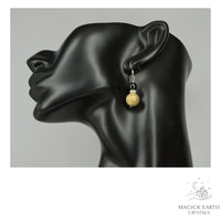 Teal Electroplated Druzy Geode and Obsidian Earrings With Platinum Finish On Display Head