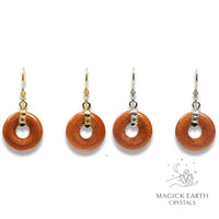 Natural Goldstone crystal donut earrings view c
