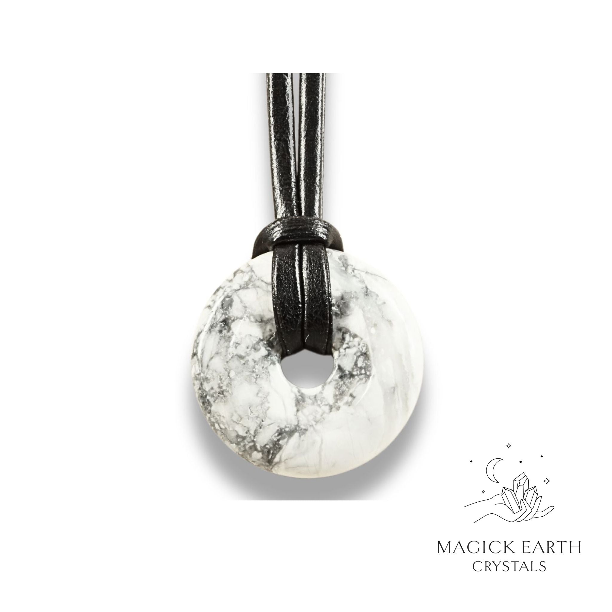 Natural 30mm howlite donut pendant hanging from a black vegan cord.