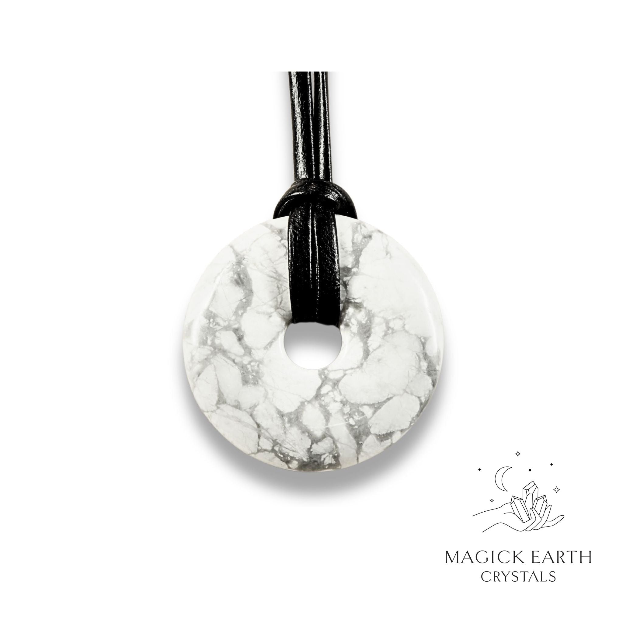 Natural 40mm howlite donut pendant hanging from a black vegan cord.