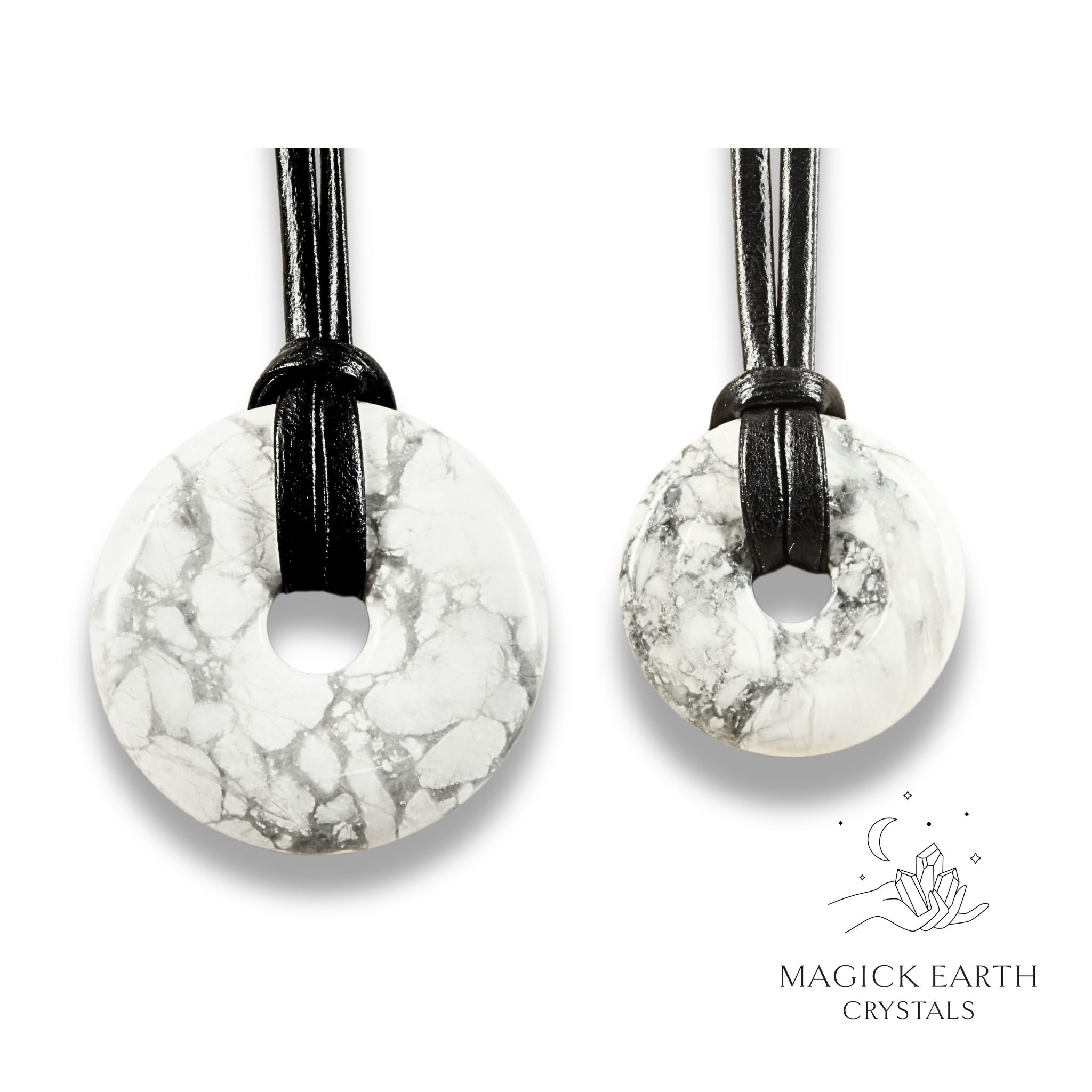 Natural howlite donut pendants in two sizes hanging from black vegan cords arranged left to right from large to small