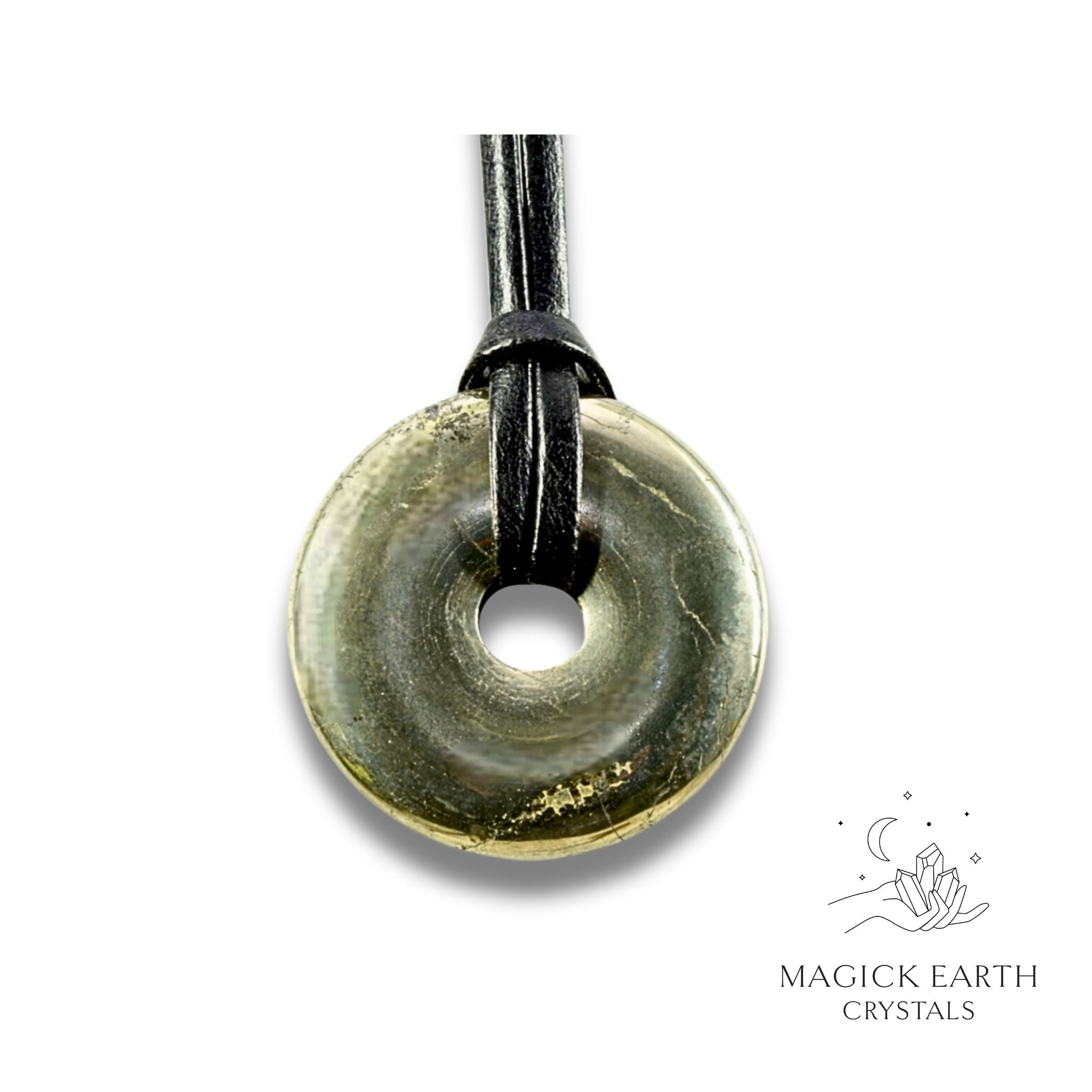 Natural 40mm iron pyrite donut pendant hanging from a black vegan cord.