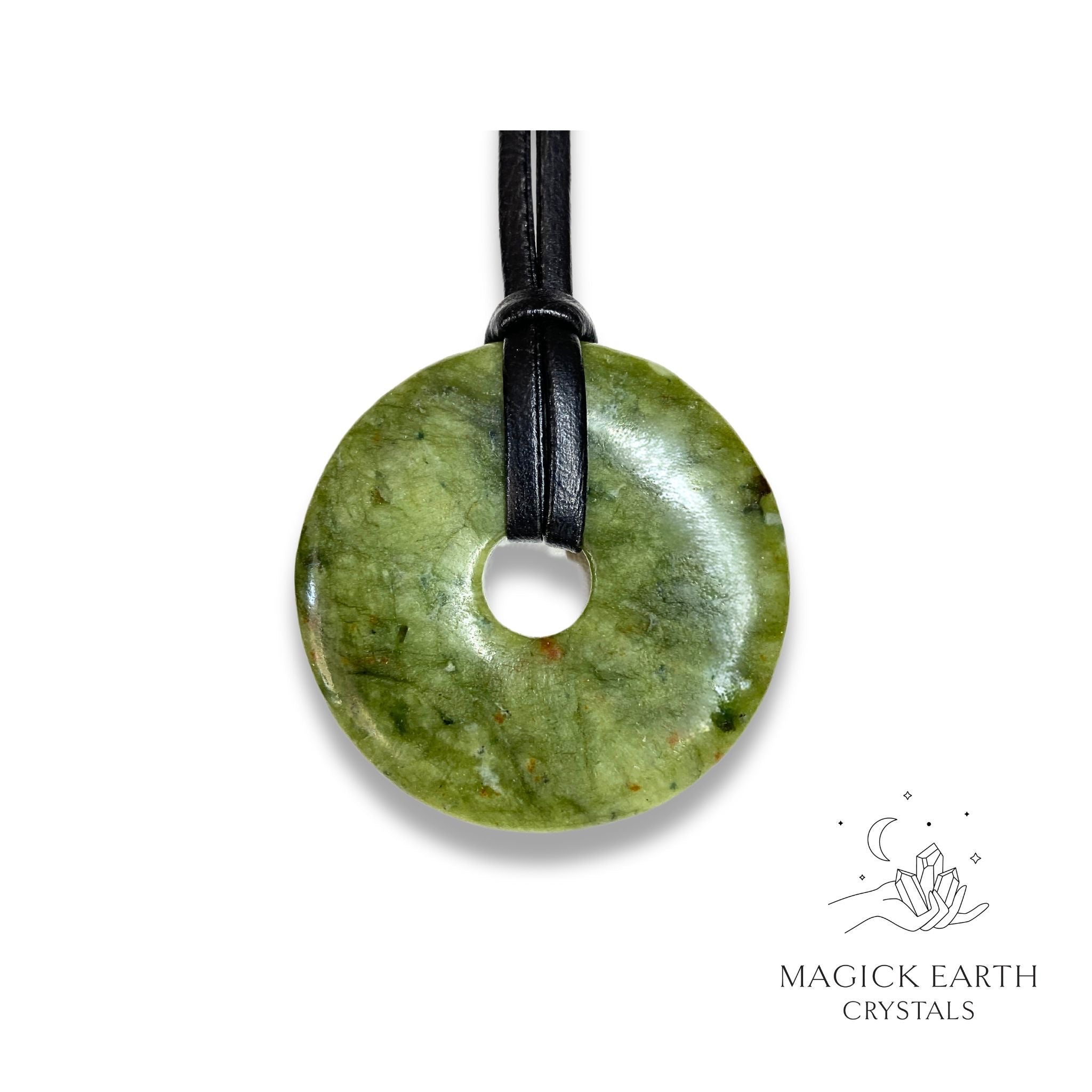 Natural 50mm jade donut pendant hanging from a black vegan cord.