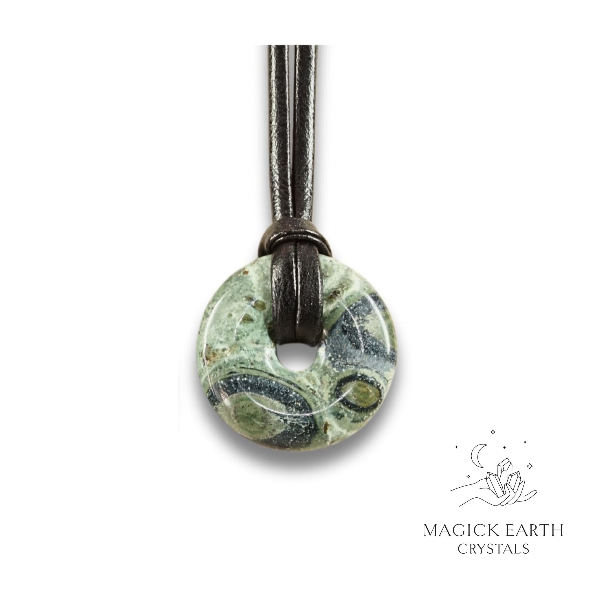 Natural 30mm kambaba jasper donut pendant hanging from a black vegan cord.