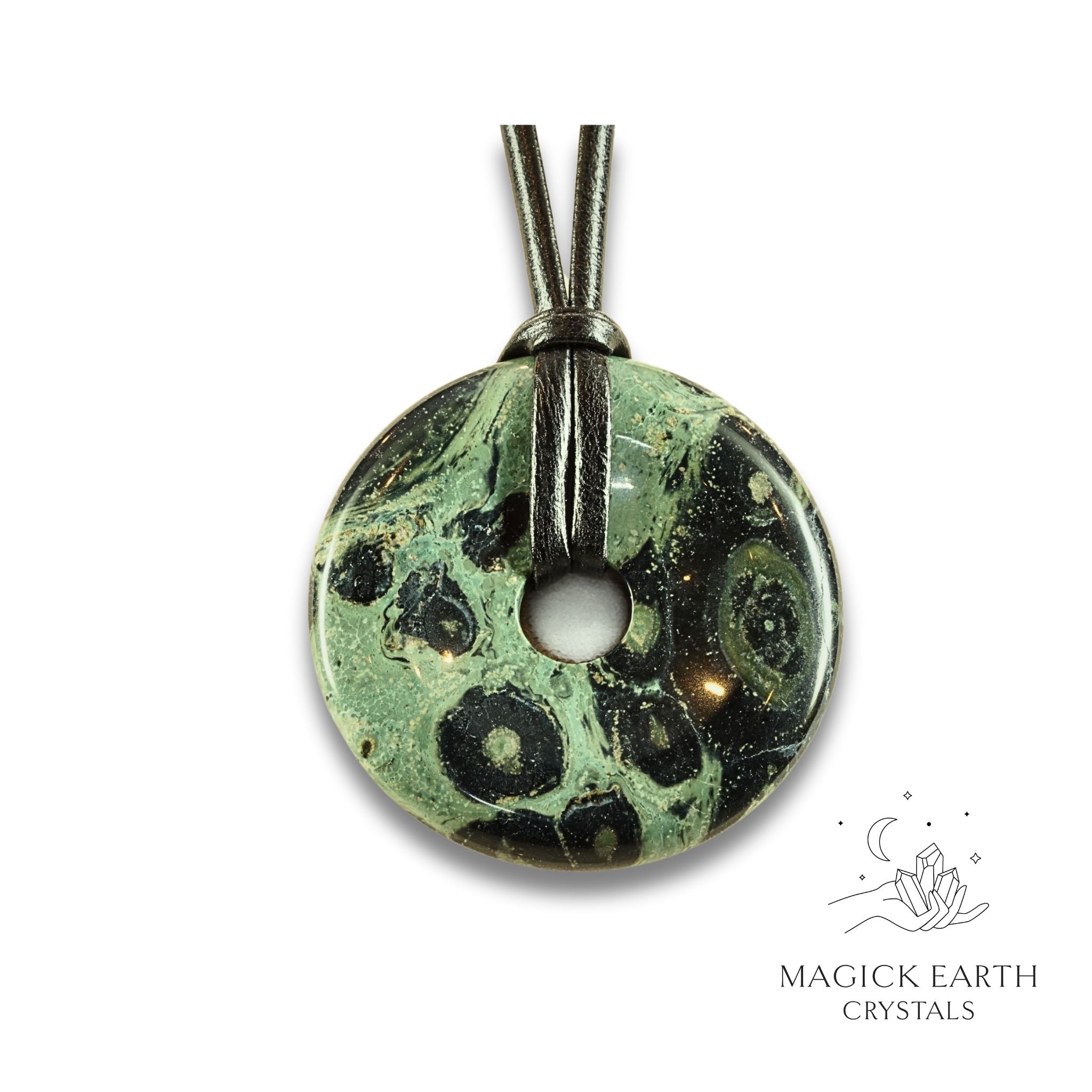 Natural 50mm kambaba jasper donut pendant hanging from a black vegan cord.