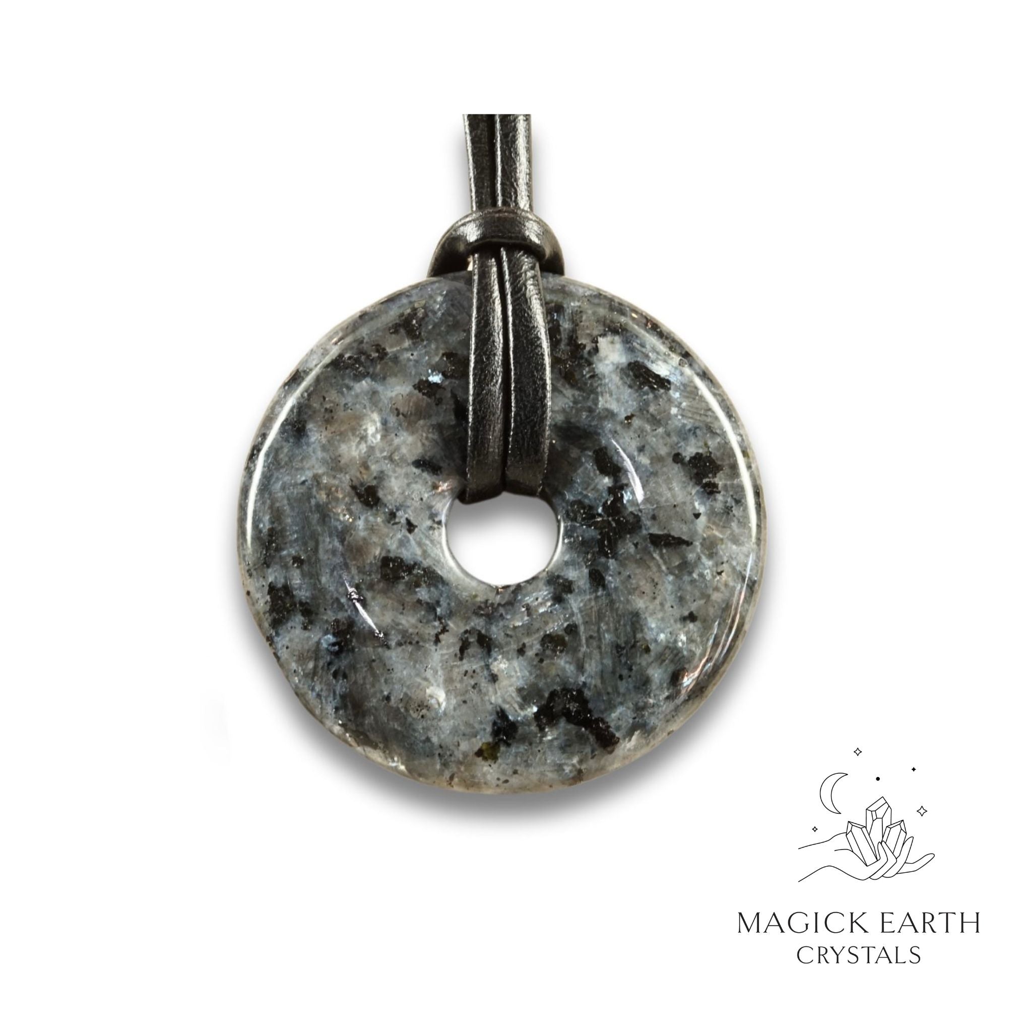 Natural 50mm larvikite donut pendant hanging from a black vegan cord.