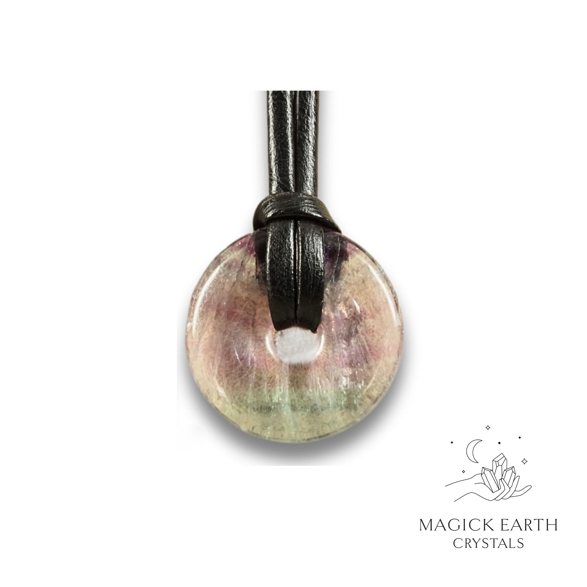 Natural 30mm light fluorite donut pendant hanging from a black vegan cord.