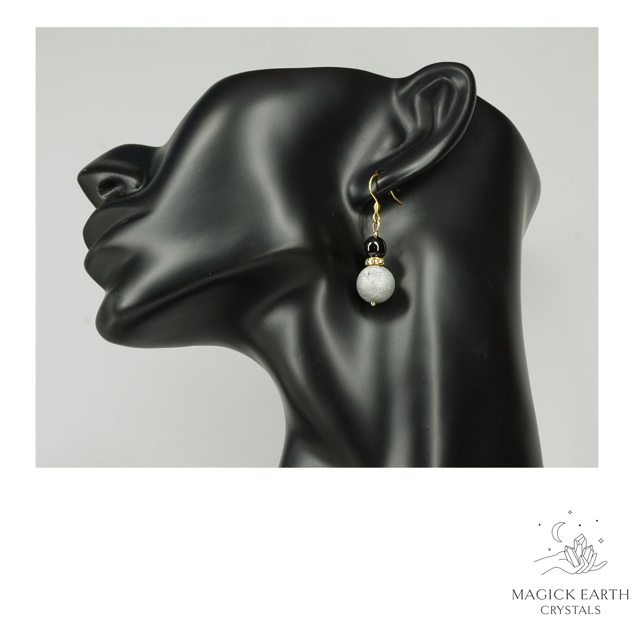 Platinum Electroplated Druzy Geode and Obsidian Earrings With Gold Finish On Display Head