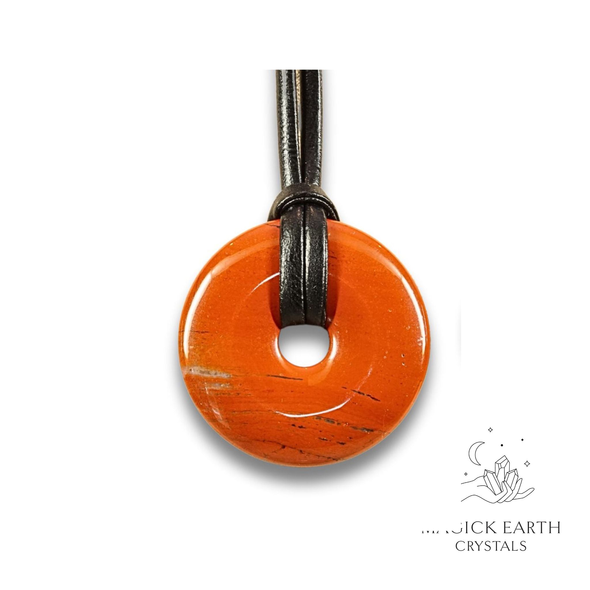 Natural 40mm red jasper donut pendant hanging from a black vegan cord.