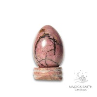 Natural Rhodonite crystal egg with stand view a