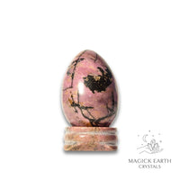 Natural Rhodonite crystal egg with stand view b