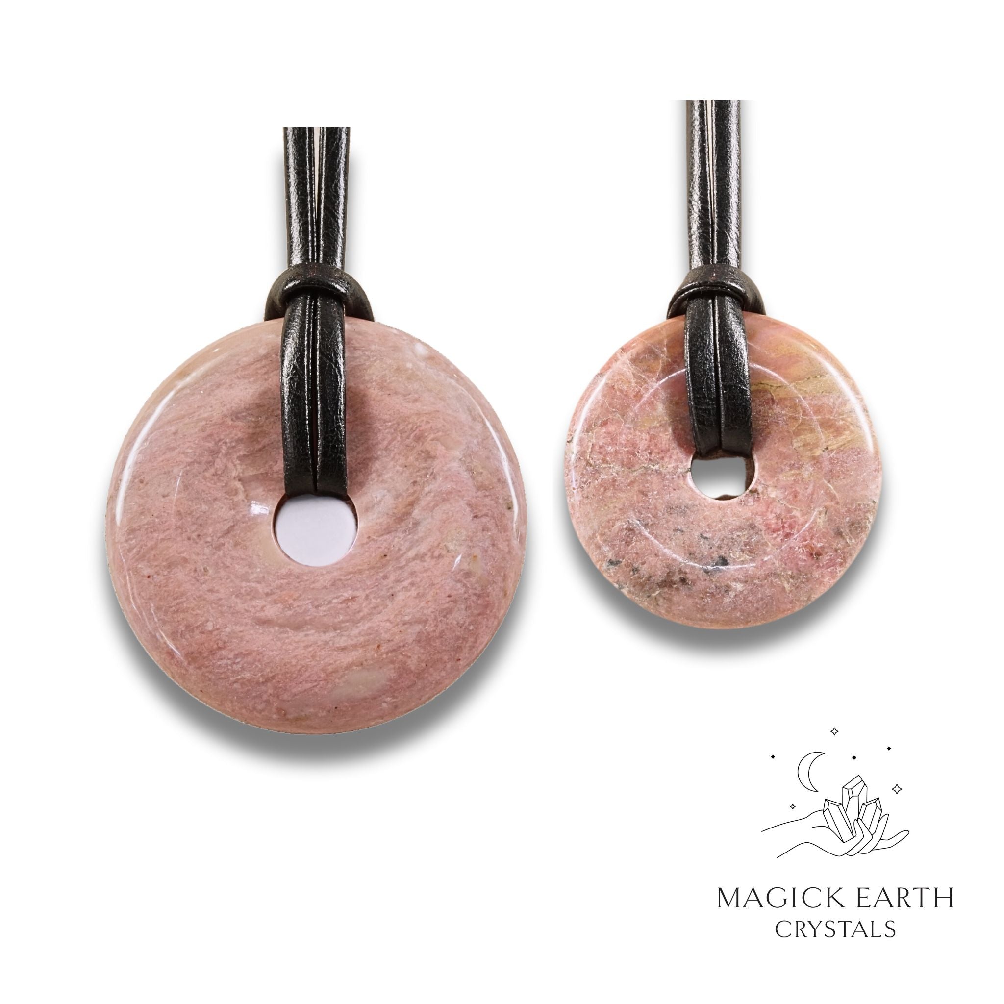 Natural lighter shade rhodonite donut pendants in two sizes hanging from black vegan cords arranged left to right from large to small