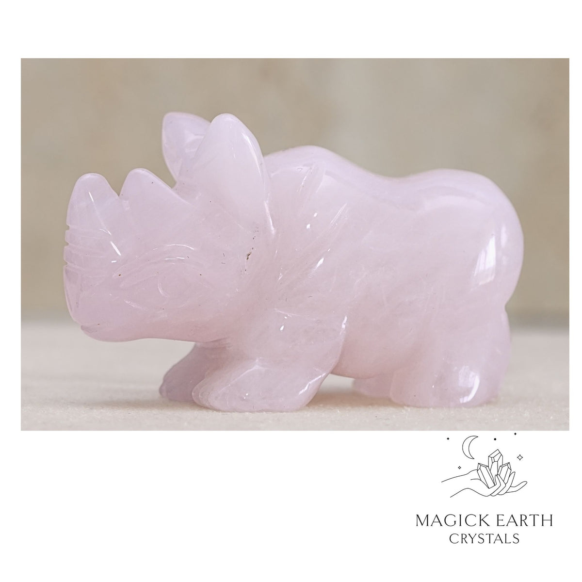 Natural Rose Quartz crystal rhinoceros figurine left view  
