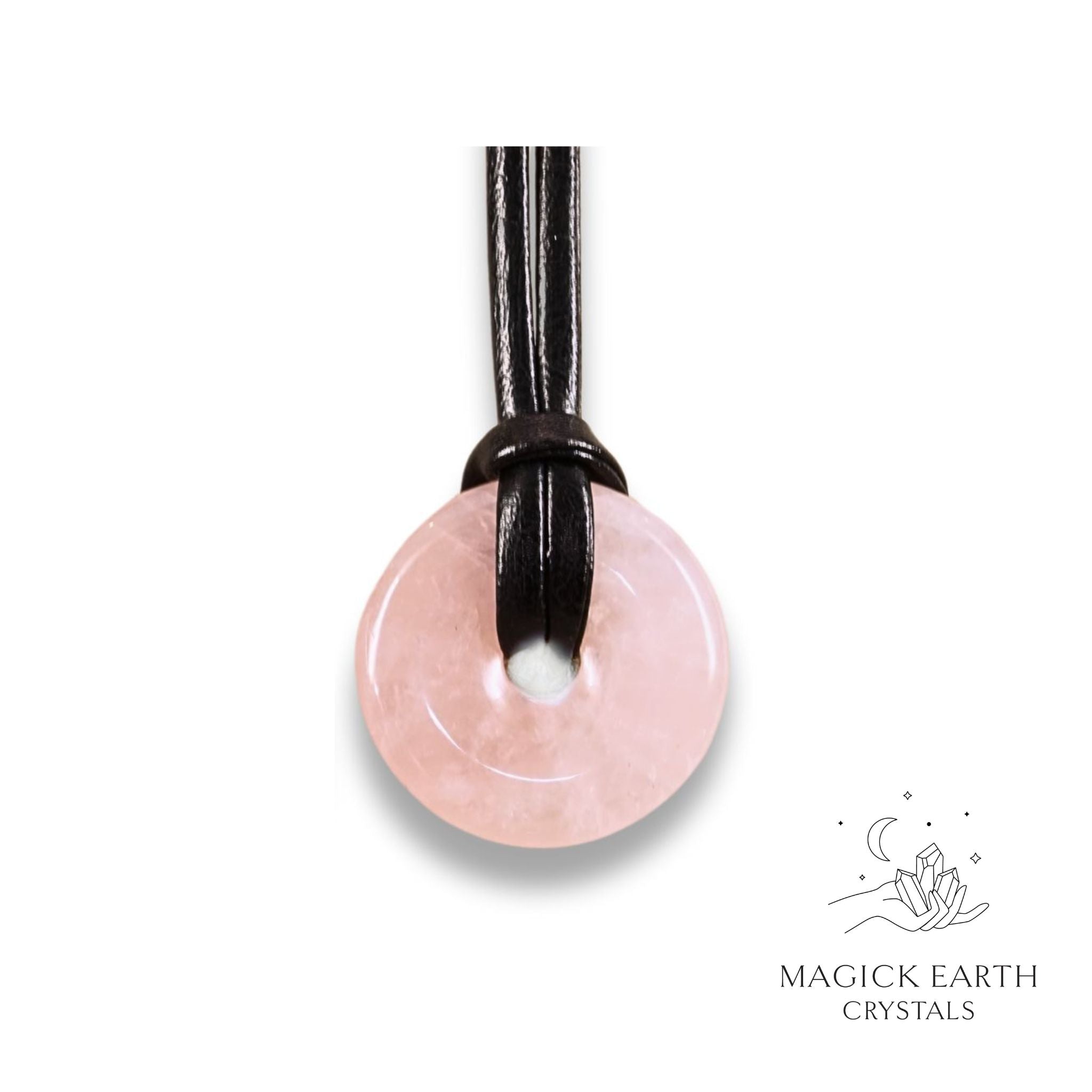 Natural 30mm rose quartz donut pendant hanging from a black vegan cord.
