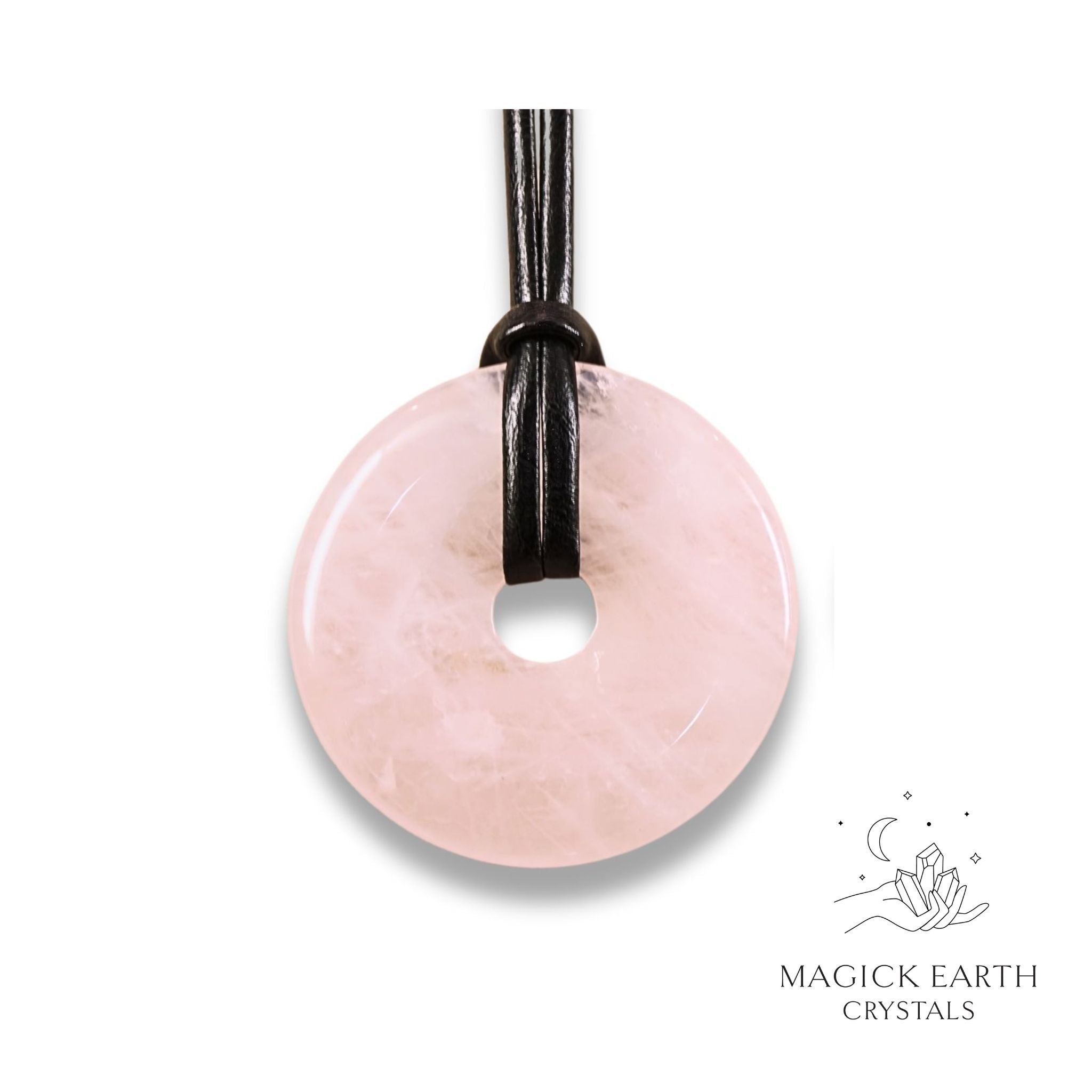 Natural 50mm rose quartz donut pendant hanging from a black vegan cord.