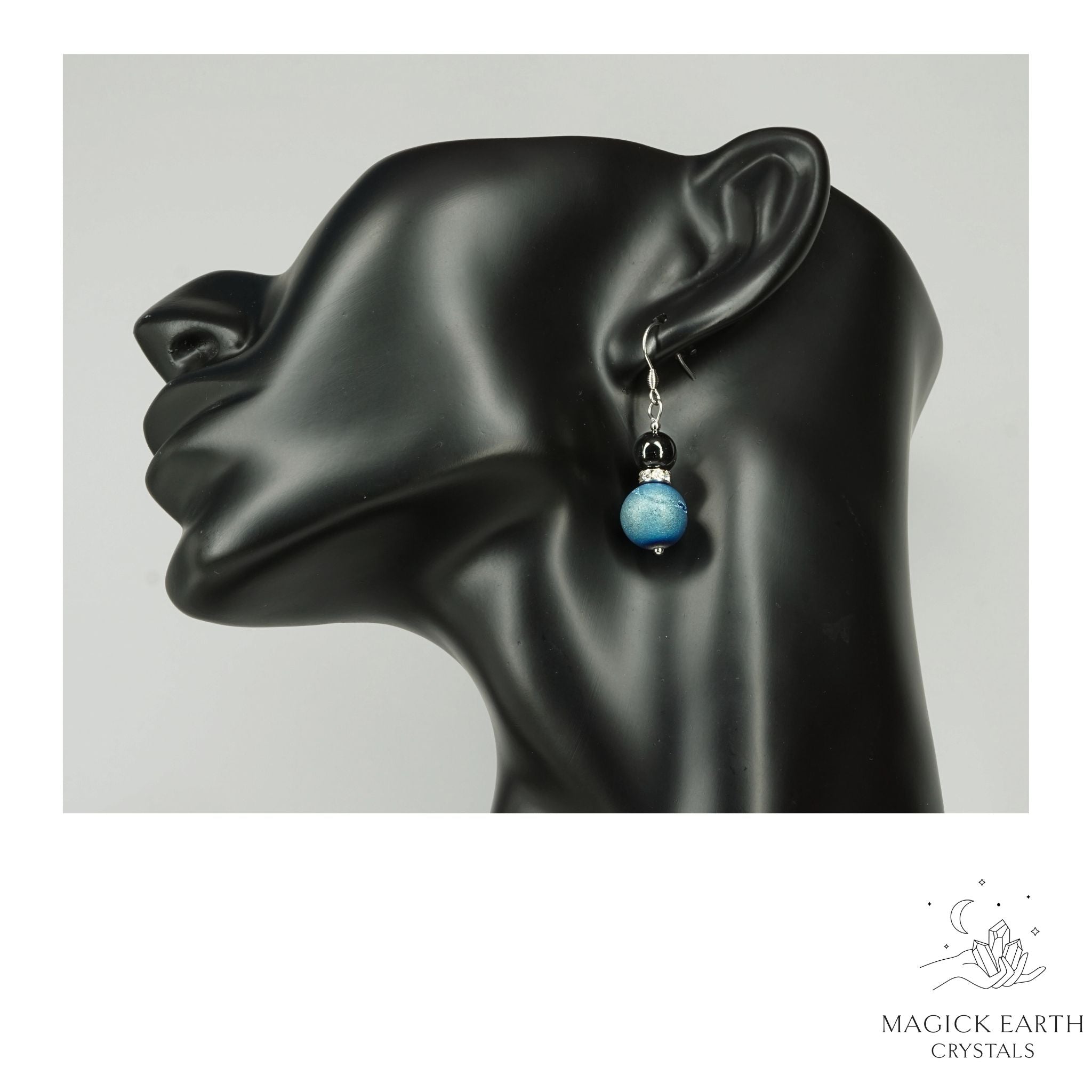 Teal Electroplated Druzy Geode and Obsidian Earrings With Platinum Finish On Display Head