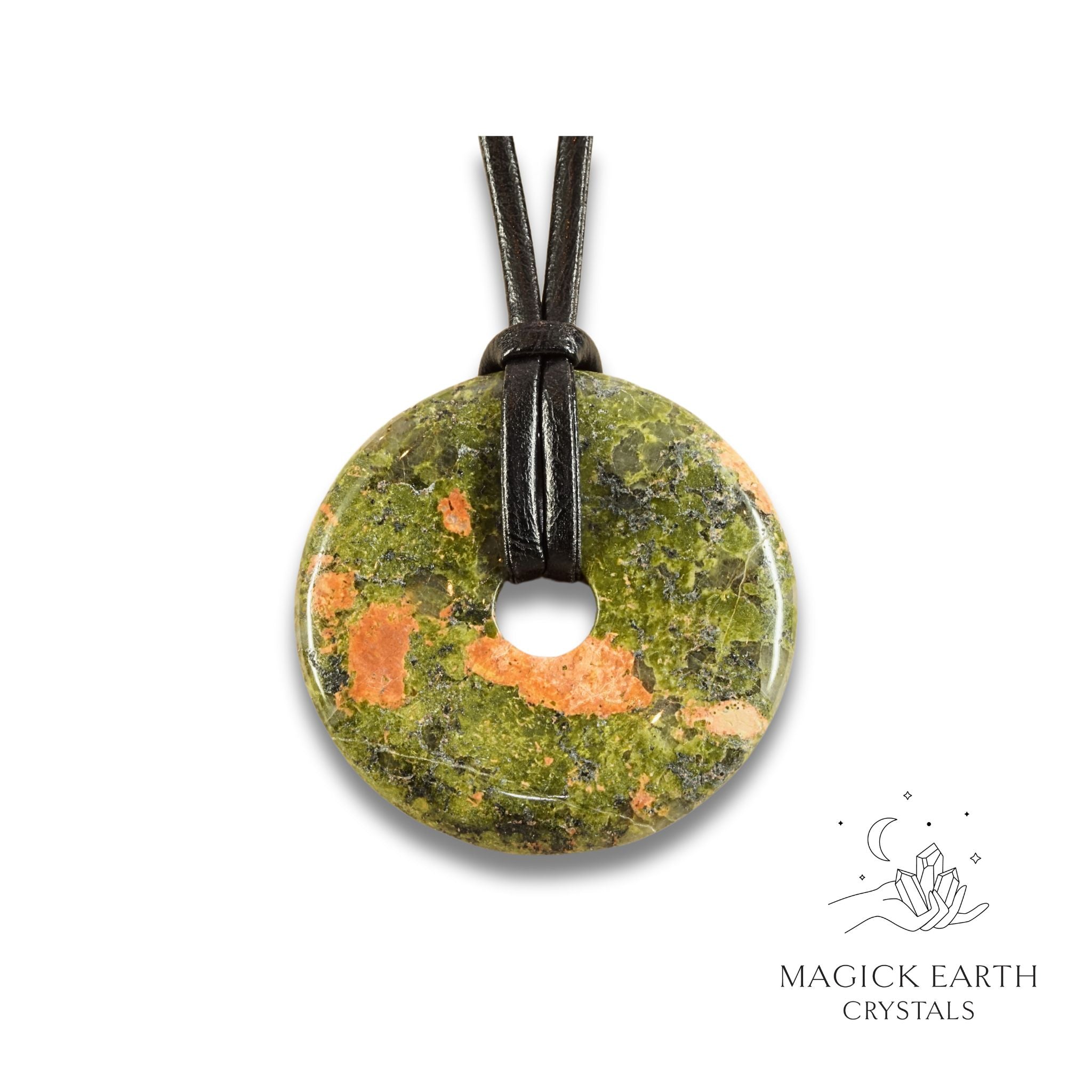 Natural 50mm unakite donut pendant hanging from a black vegan cord.