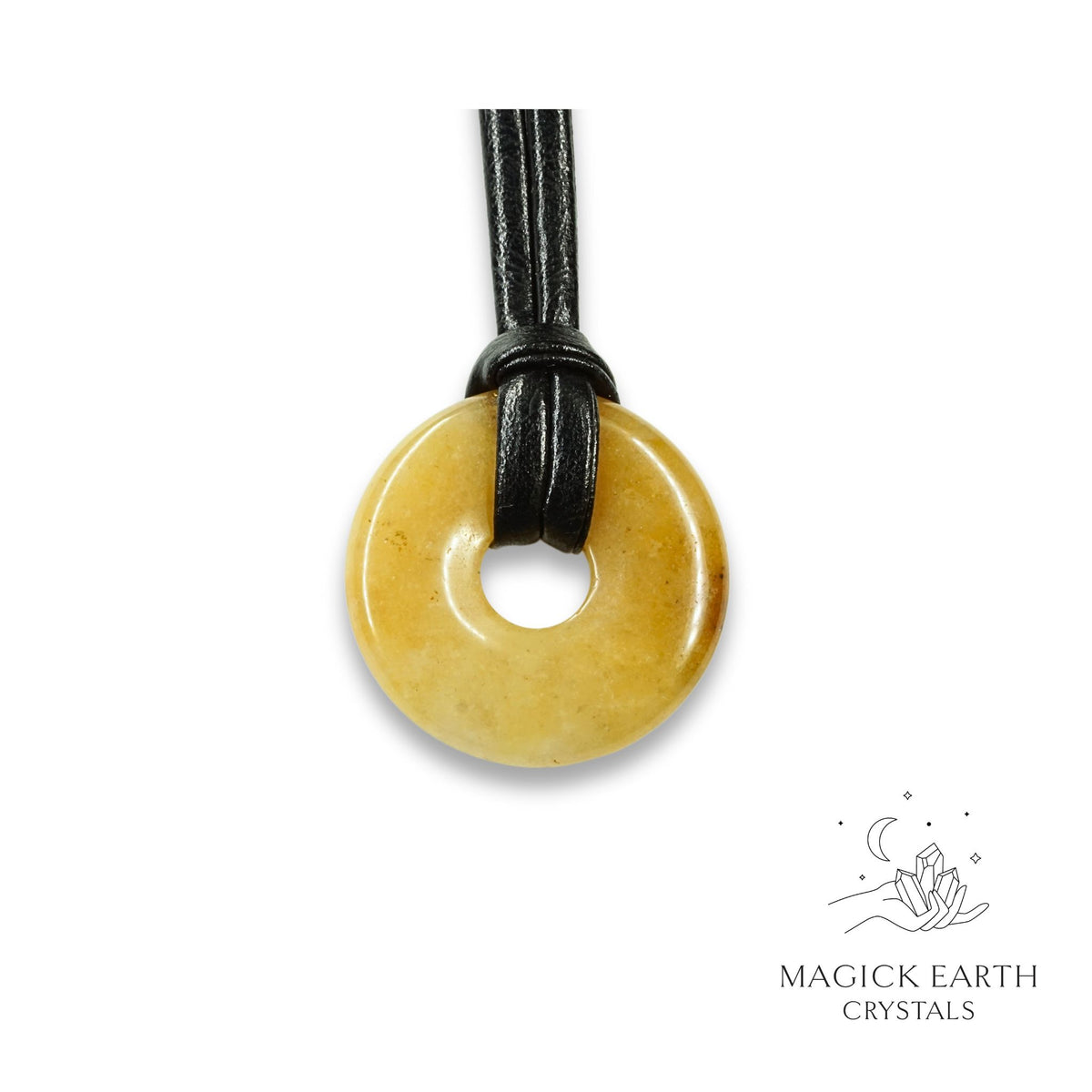 Natural 30mm yellow jade donut pendant hanging from a black vegan cord
