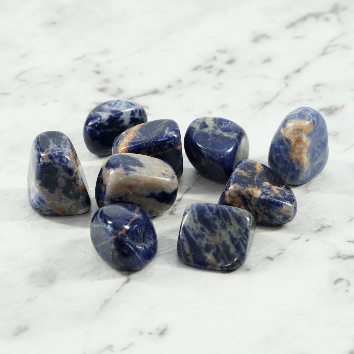 Sodalite Crystal Tumbled Stone with Orange Feldspar Inclusions