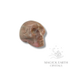 Rhodonite Crystal Gemstone Carved Tiny  Skull Left View