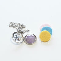 Natural Amethyst triskele diffuser pendant view c