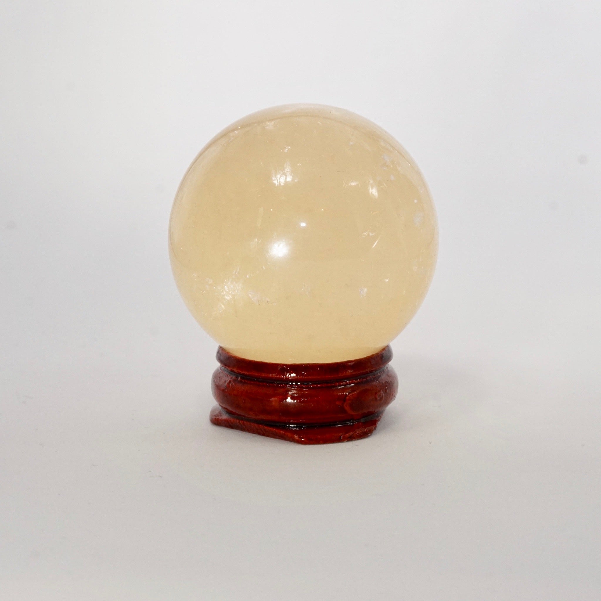 Natural Honey Calcite crystal sphere view c