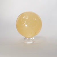 Natural Honey Calcite crystal sphere view d