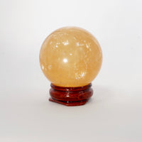 Natural Honey Calcite crystal sphere view e