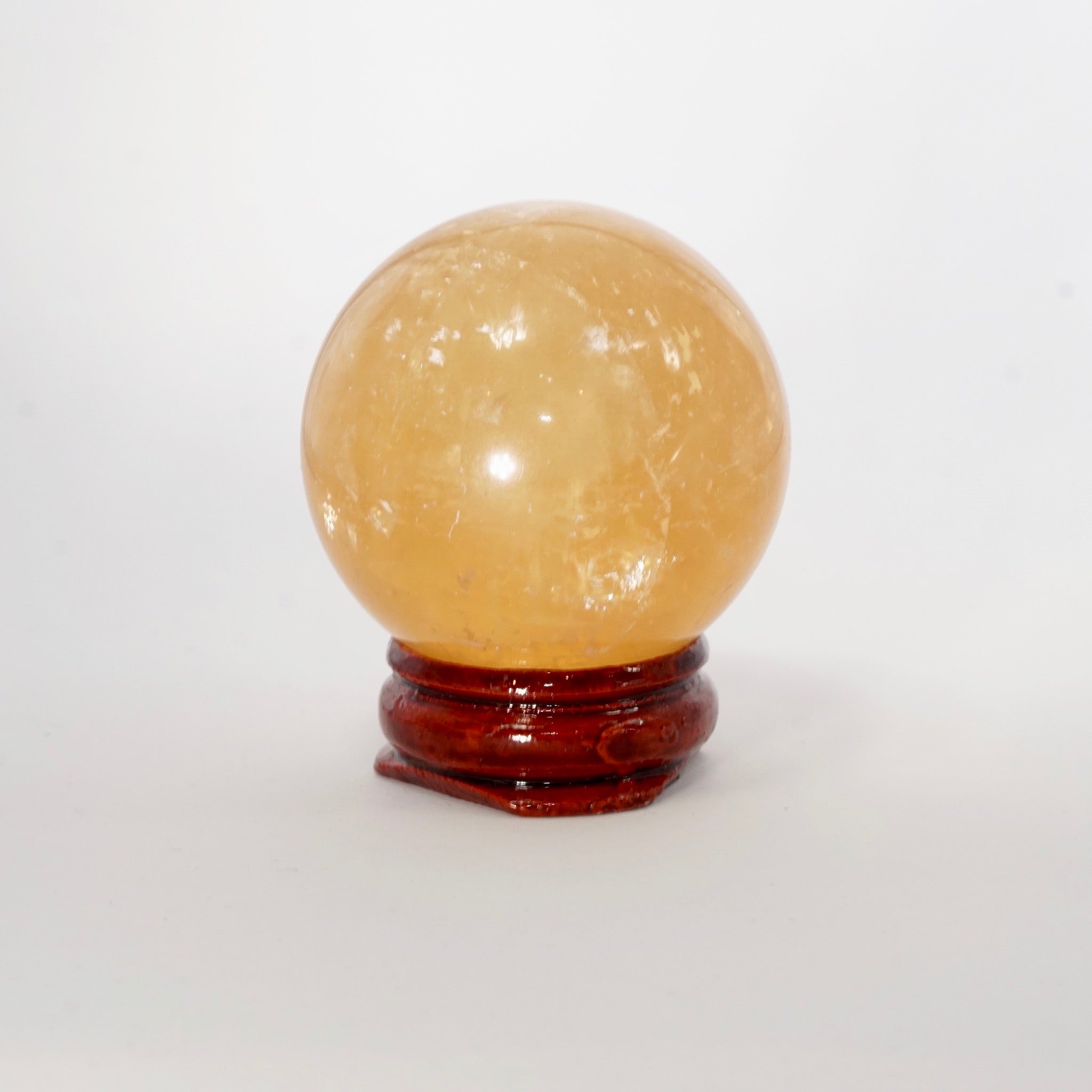Natural Honey Calcite crystal sphere view e