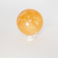 Natural Honey Calcite crystal sphere view f