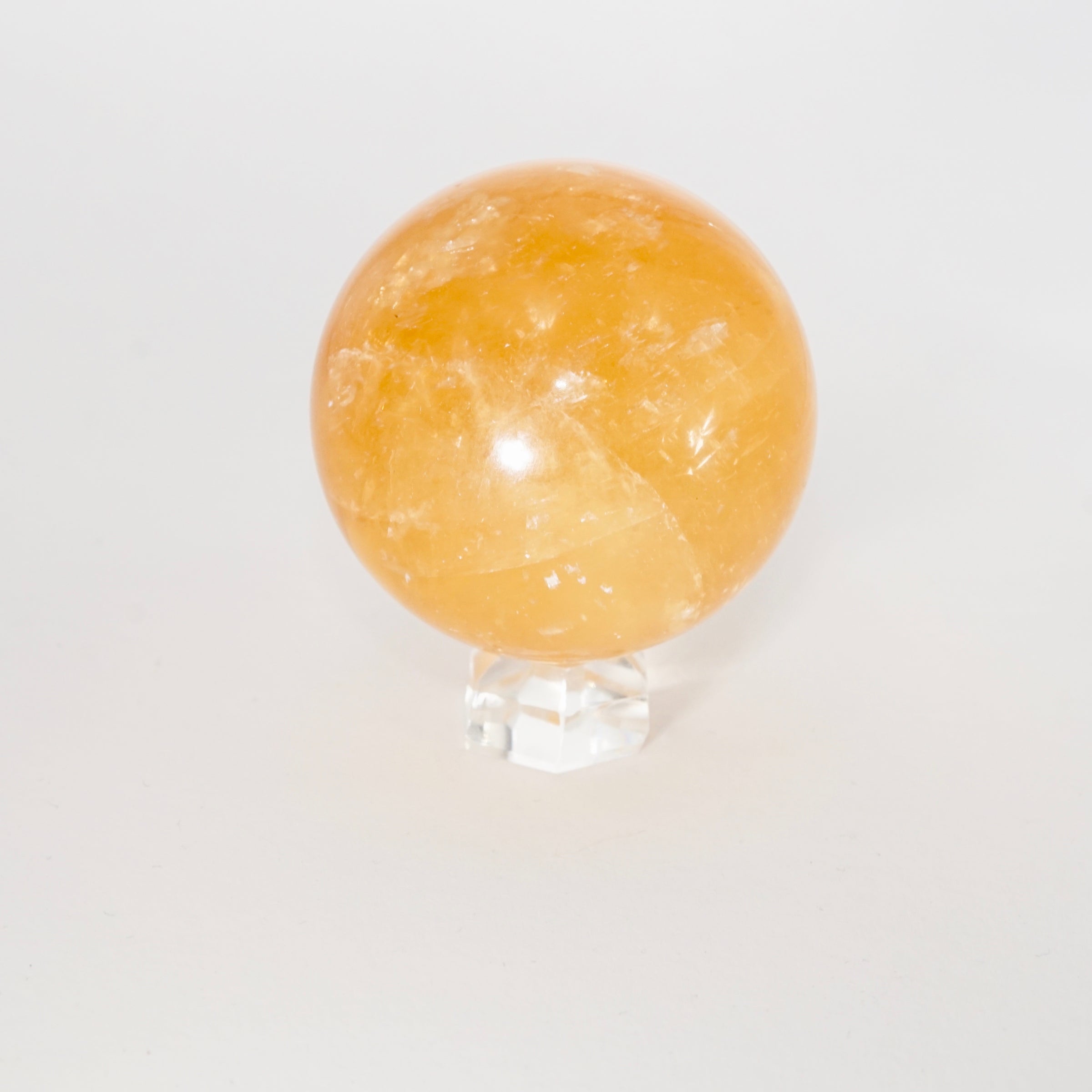 Natural Honey Calcite crystal sphere view f