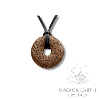 Natural brown lava donut pendant hanging from a black vegan cord.