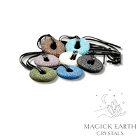 Mixed colour lava  donut pendants with black vegan cords displayed laying flat